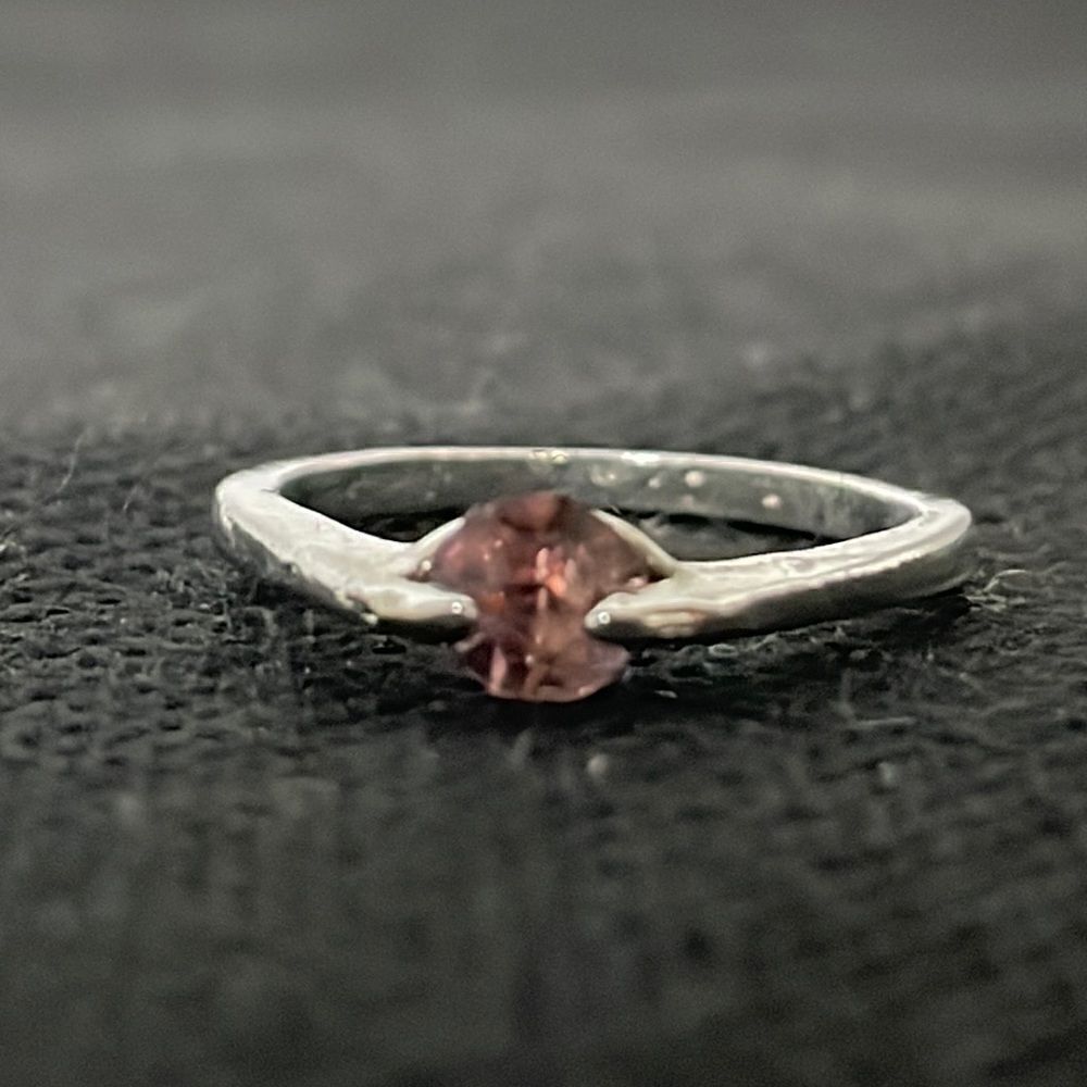 Small ring with a pink gem